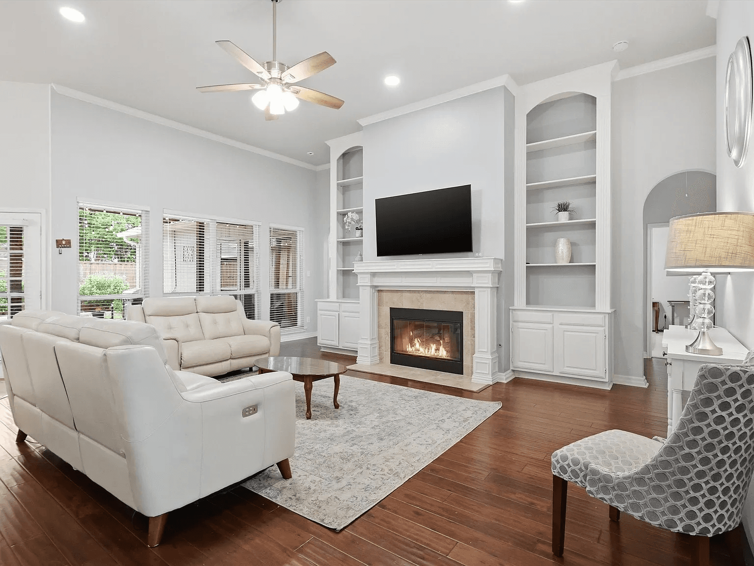 Living room with fireplace and comfortable seating at Oakridge Manor Living